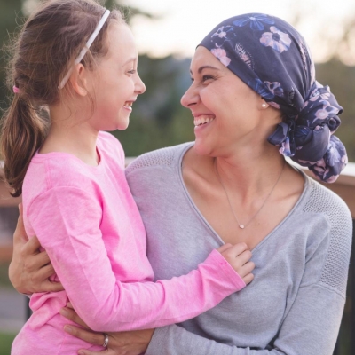 Cancer survivor smiling with daughter