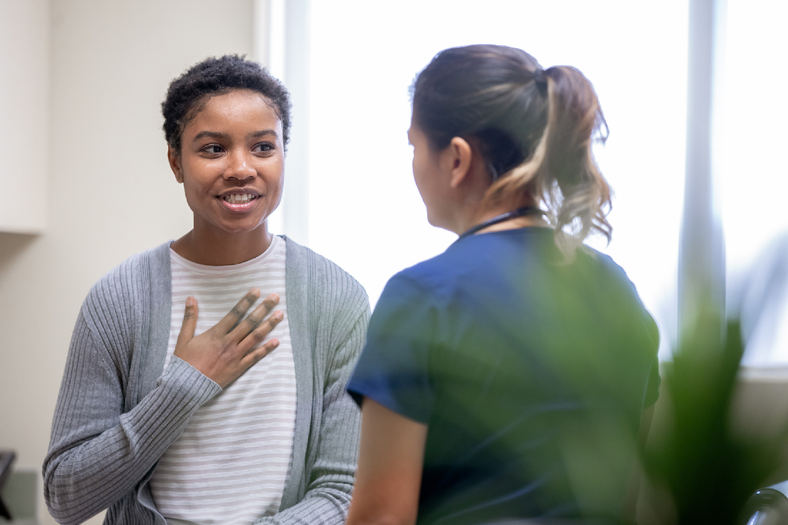 A Woman Speaks to a Friend About Cancer