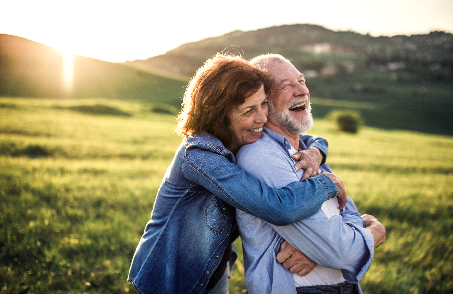 Senior Couple Hug Outdoors 