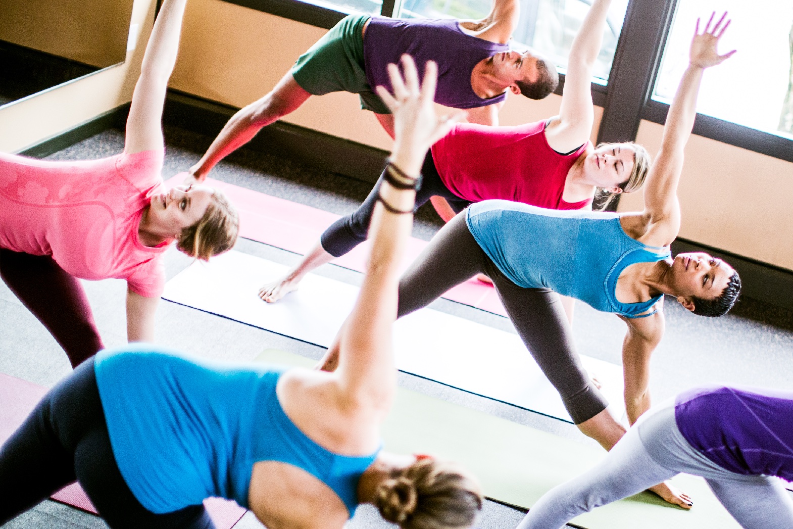 A group of people doing yoga.