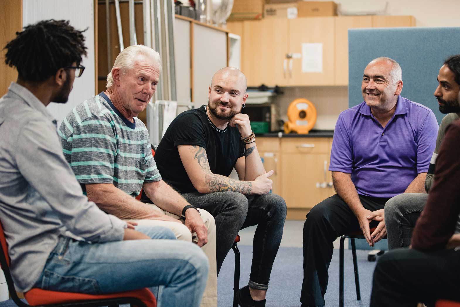 A group of men talking.